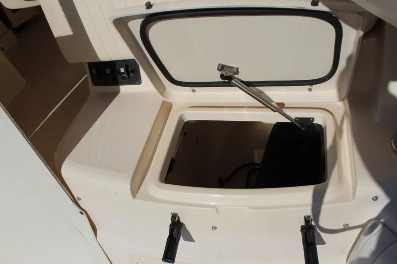 Slide: The Image of Helm of 2008 Grady-White Express 330 with Garmin navigation displays and controls. - 32