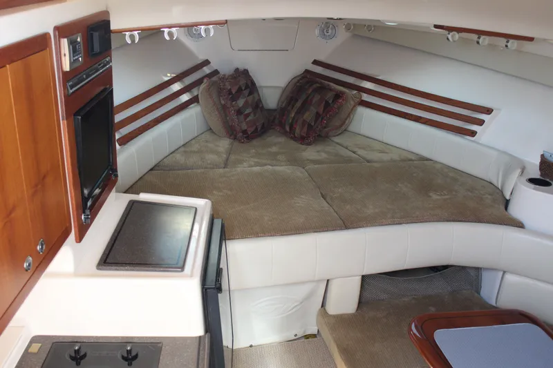 Slide: The Image of 2008 Grady-White Express 330 boat with twin Yamaha engines on calm water. - 4