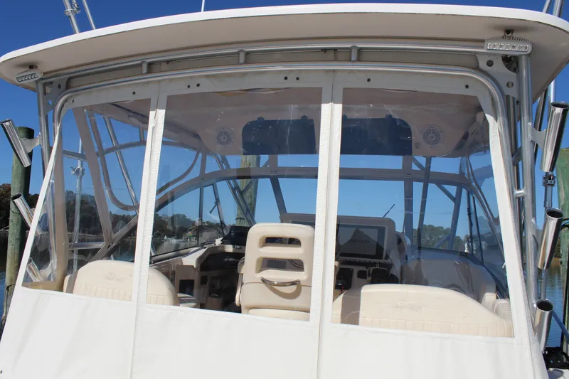 Slide: The Image of 2008 Grady-White Express 330 interior with safety equipment and certification labels. - 40