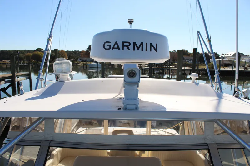 Slide: The Image of 2008 Grady-White Express 330 boat interior with white cushioned seating. - 41