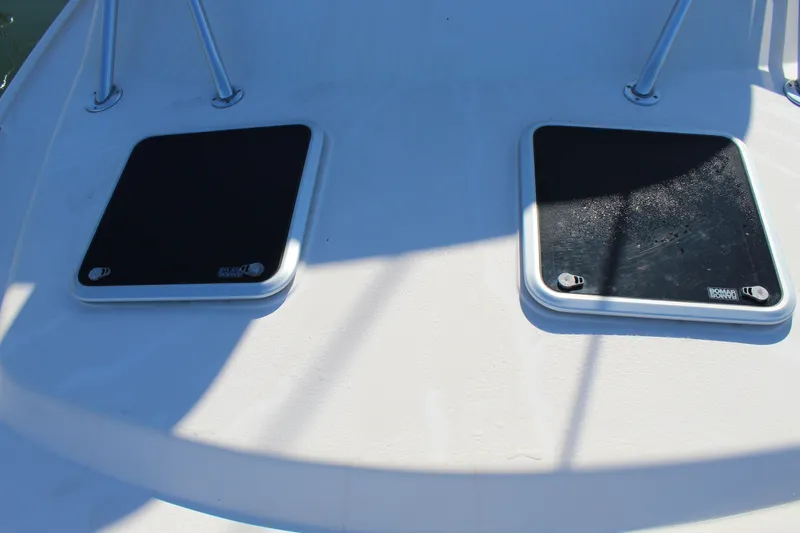 Slide: The Image of 2008 Grady-White Express 330 boat sink with open lid and faucet. - 44