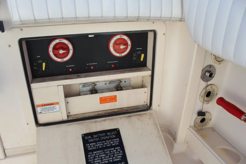 Slide: The Image of Control panel of a 2008 Grady-White Express 330 boat with dual battery switches. - 49