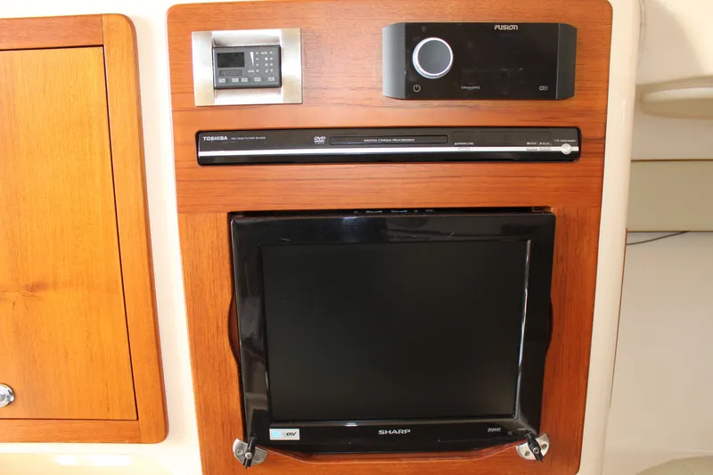 Slide: The Image of 2008 Grady-White Express 330 boat on calm water, front view with Garmin equipment. - 7