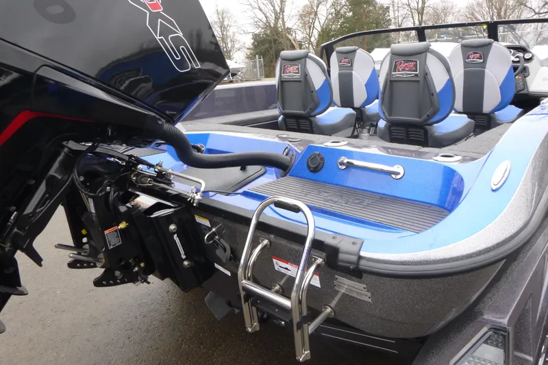 Slide: The Image of 2026 Ranger 620FS Cup Equipped boat with blue seats and powerful motor. - 12