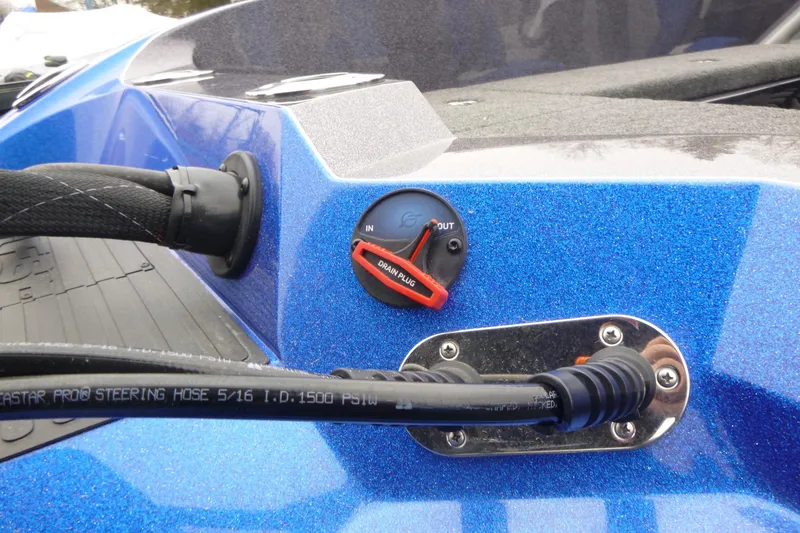 Slide: The Image of 2026 Ranger 620FS Cup Equipped boat detail with steering hose and drain plug. - 13