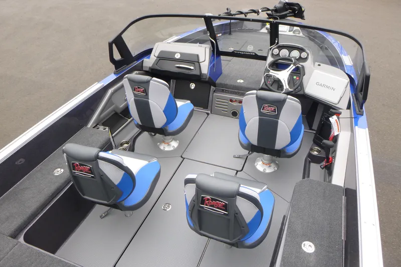 Slide: The Image of 2026 Ranger 620FS Cup Equipped boat interior with four blue and gray seats, Garmin dashboard. - 14