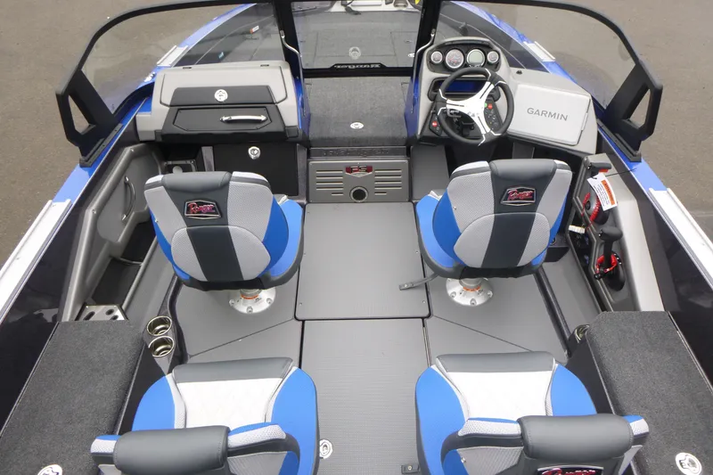 Slide: The Image of 2026 Ranger 620FS Cup Equipped boat interior with blue seats and Garmin navigation. - 15