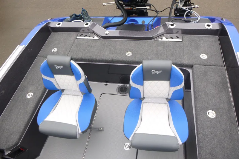 Slide: The Image of 2026 Ranger 620FS Cup Equipped boat interior with blue and gray seating. - 16