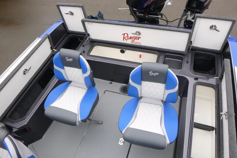 Slide: The Image of 2026 Ranger 620FS Cup Equipped boat interior with blue and white seats. - 17