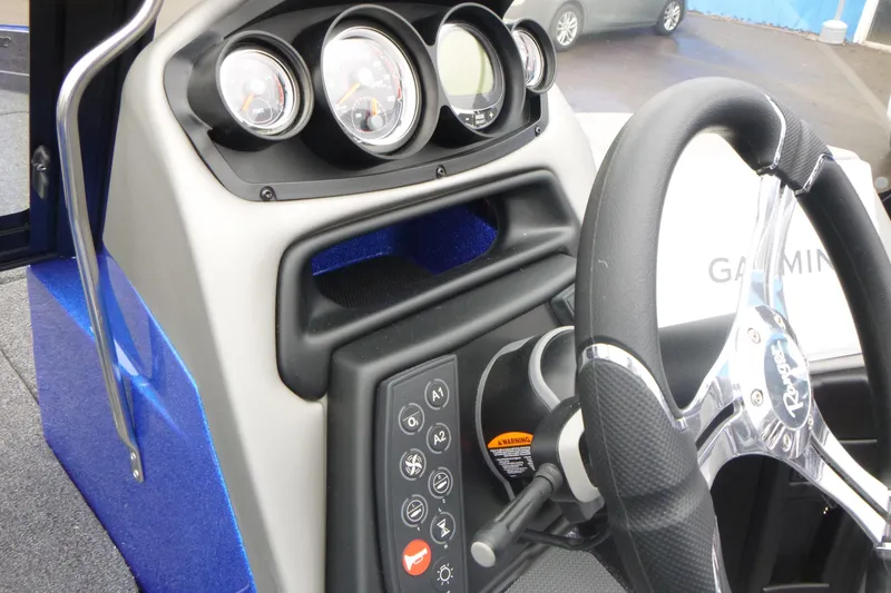 Slide: The Image of 2026 Ranger 620FS Cup Equipped boat dashboard with steering wheel and control panel. - 24
