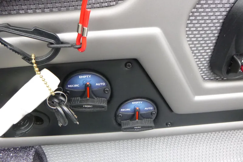 Slide: The Image of Control panel of 2026 Ranger 620FS Cup Equipped boat with switches and keys. - 27