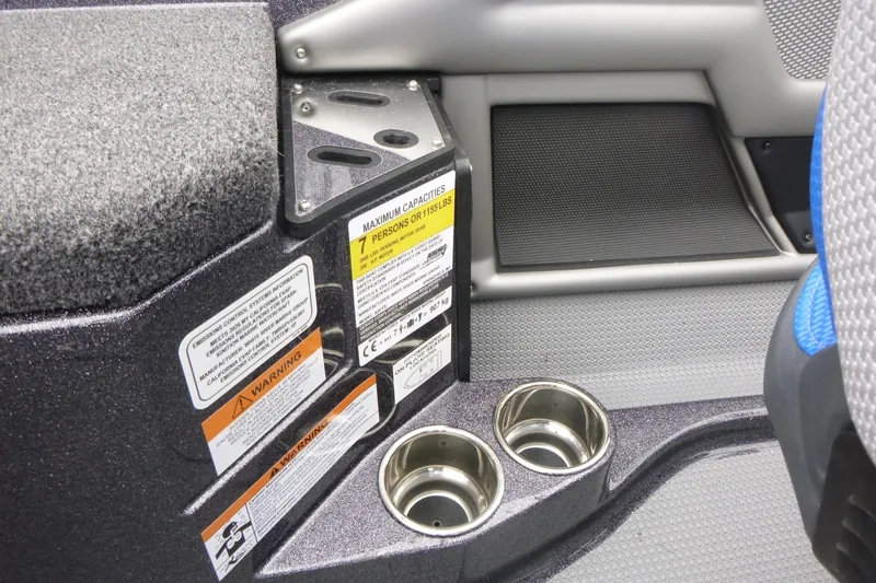 Slide: The Image of 2026 Ranger 620FS Cup Equipped boat interior with cup holders and safety labels. - 30