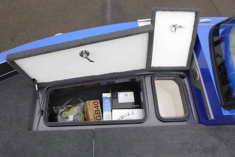 Slide: The Image of Storage compartments in a 2026 Ranger 620FS Cup Equipped boat, featuring organized gear. - 34