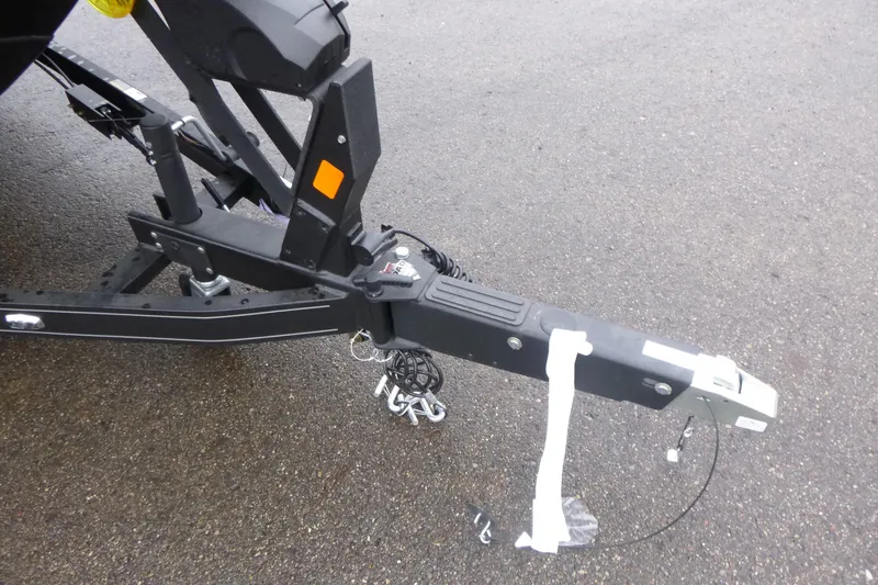 Slide: The Image of Trailer hitch of 2026 Ranger 620FS Cup Equipped on wet pavement. - 5