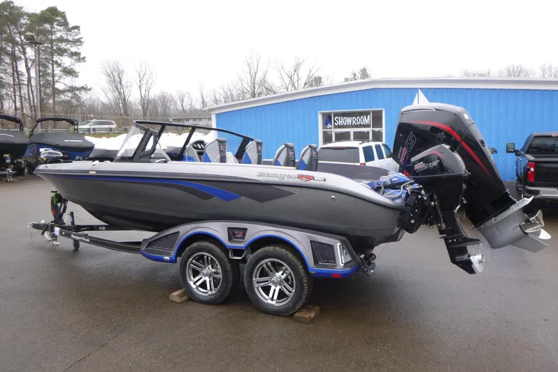 Slide: The Image of 2026 Ranger 620FS Cup Equipped boat on trailer outside showroom. - 7