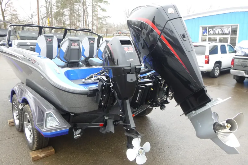 Slide: The Image of 2026 Ranger 620FS Cup Equipped boat with powerful outboard motor in showroom setting. - 8