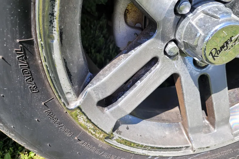 Slide: The Image of Close-up of a 2020 Ranger Z521L wheel with radial tire and visible wear. - 12