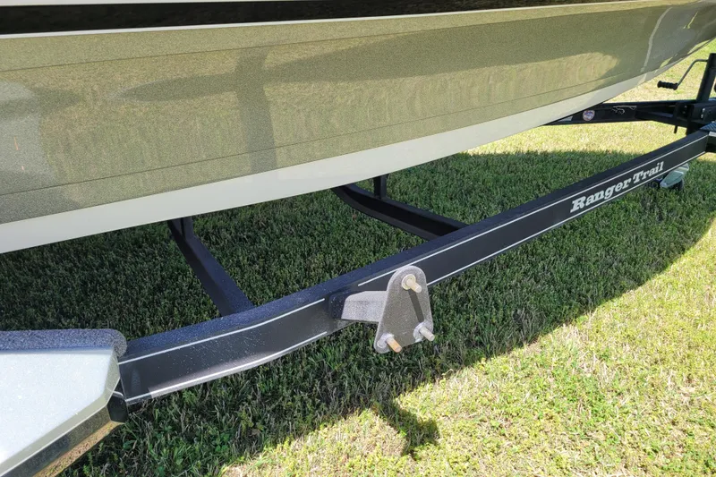 Slide: The Image of 2020 Ranger Z521L boat trailer on grass, featuring Ranger Trail branding. - 13