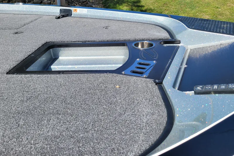 Slide: The Image of 2020 Ranger Z521L boat deck with storage compartment and cup holder. - 15