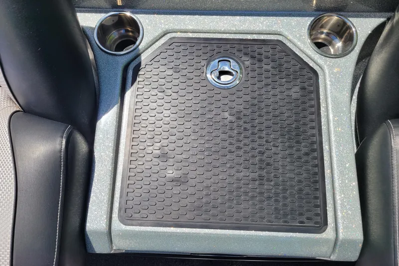 Slide: The Image of 2020 Ranger Z521L boat console with cup holders and textured mat. - 23