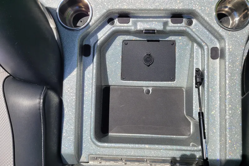 Slide: The Image of 2020 Ranger Z521L boat console with cup holders and storage compartment. - 24