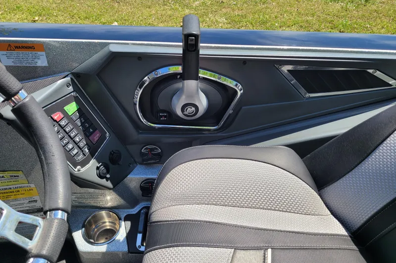 Slide: The Image of 2020 Ranger Z521L boat cockpit with steering wheel and control panel. - 25