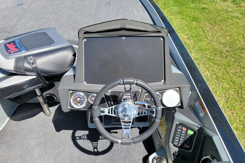 Slide: The Image of 2020 Ranger Z521L boat dashboard with steering wheel and control panel. - 26