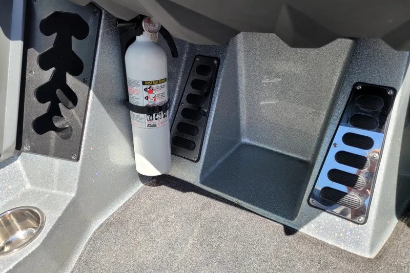 Slide: The Image of 2020 Ranger Z521L boat interior with fire extinguisher and storage compartments. - 29