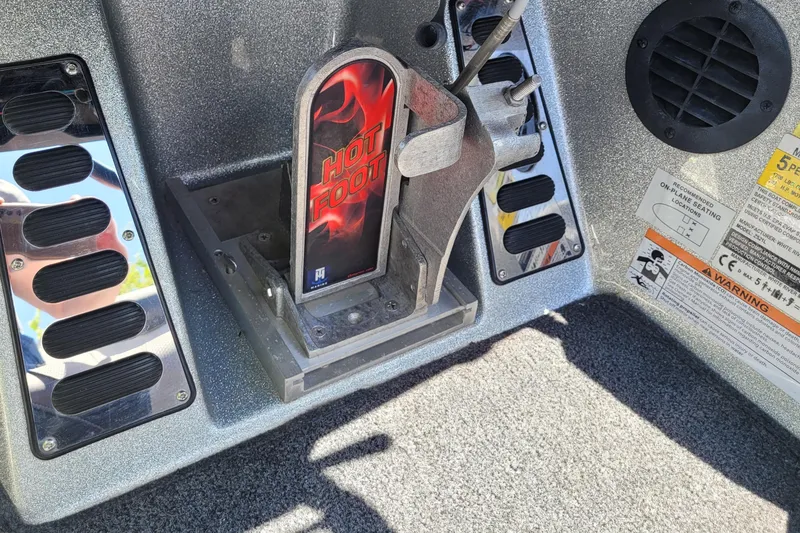 Slide: The Image of 2020 Ranger Z521L boat foot pedal with "Hot Foot" branding and warning labels. - 31