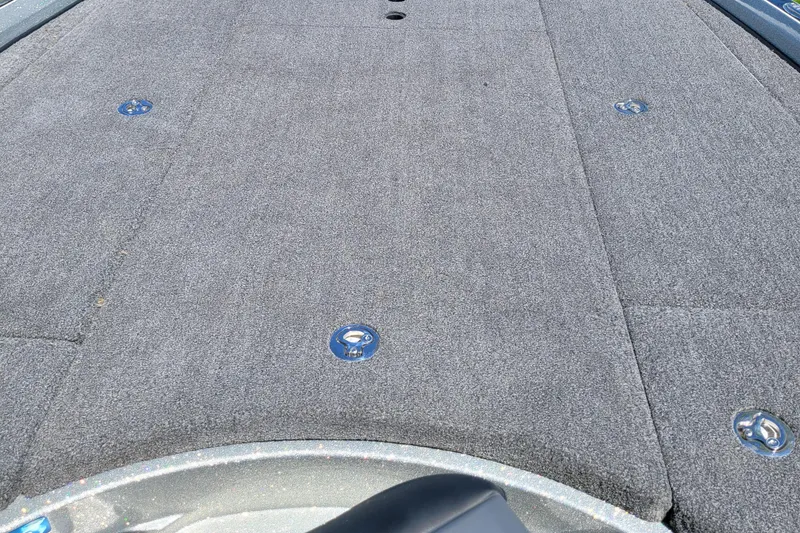 Slide: The Image of 2020 Ranger Z521L boat deck with gray carpet and metal fixtures. - 32