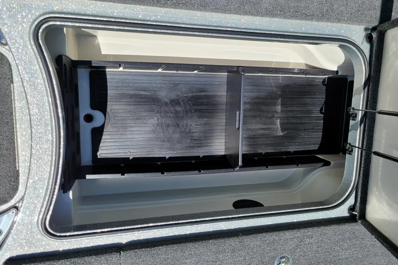 Slide: The Image of 2020 Ranger Z521L storage compartment with black liner and divider. - 37