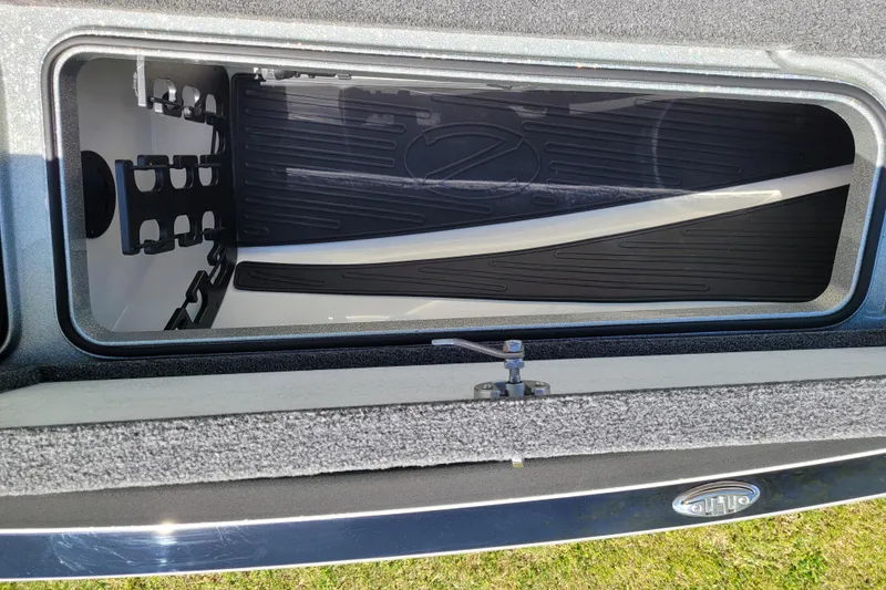 Slide: The Image of 2020 Ranger Z521L boat storage compartment with organized interior layout. - 38