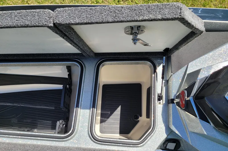 Slide: The Image of 2020 Ranger Z521L boat storage compartments with open lids, showcasing interior space. - 39