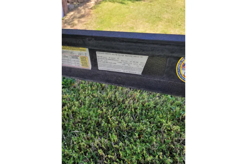 Slide: The Image of 2020 Ranger Z521L label on a boat trailer, displayed outdoors on grass. - 47