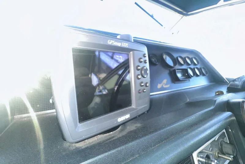 Slide: The Image of Dashboard of 1987 Sea Ray 300 Sundancer with GPS device and control panel. - 17