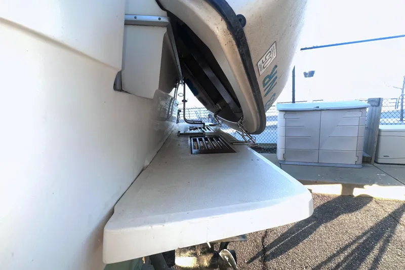 Slide: The Image of 1987 Sea Ray 300 Sundancer boat detail with outdoor storage in background. - 5