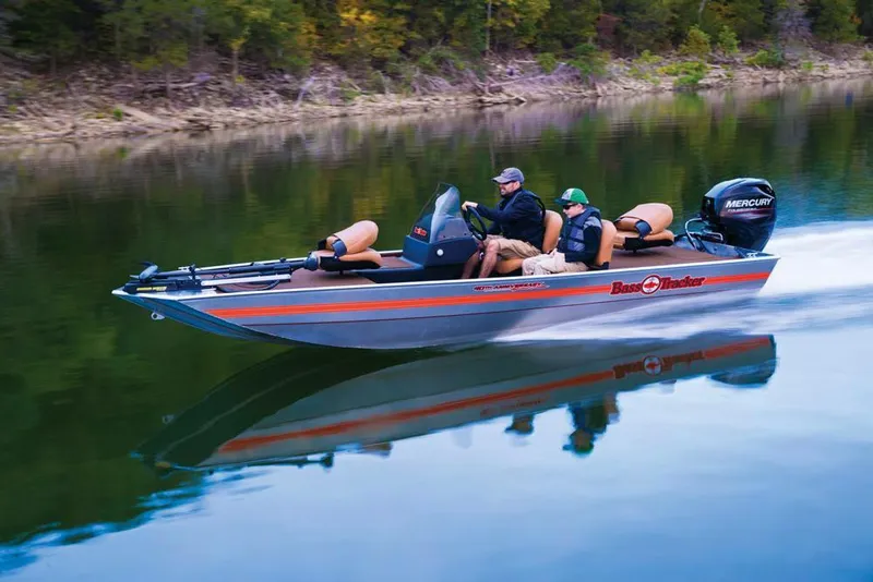Slide: The Image of 2018 Tracker Bass Tracker 40th Anniversary Heritage Edition boat cruising on a calm lake. - 10