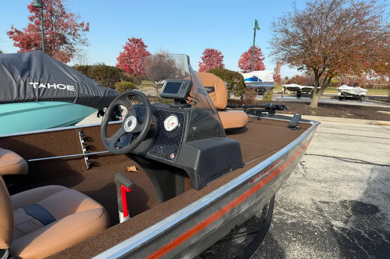 Slide: The Image of 2018 Tracker Bass Tracker 40th Anniversary Heritage Edition boat with steering console. - 2