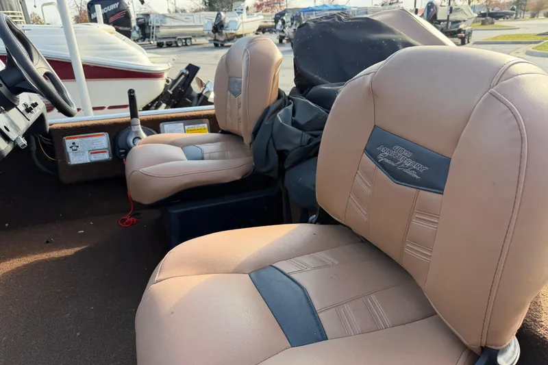Slide: The Image of 2018 Tracker Bass Tracker 40th Anniversary Heritage Edition boat seats, tan upholstery, outdoor setting. - 4