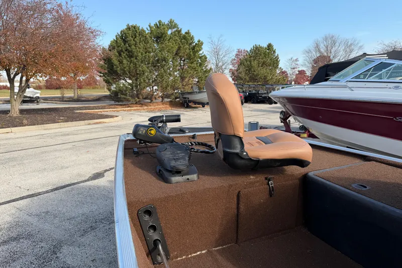 Slide: The Image of 2018 Tracker Bass Tracker 40th Anniversary Heritage Edition boat with tan seat and trolling motor. - 5