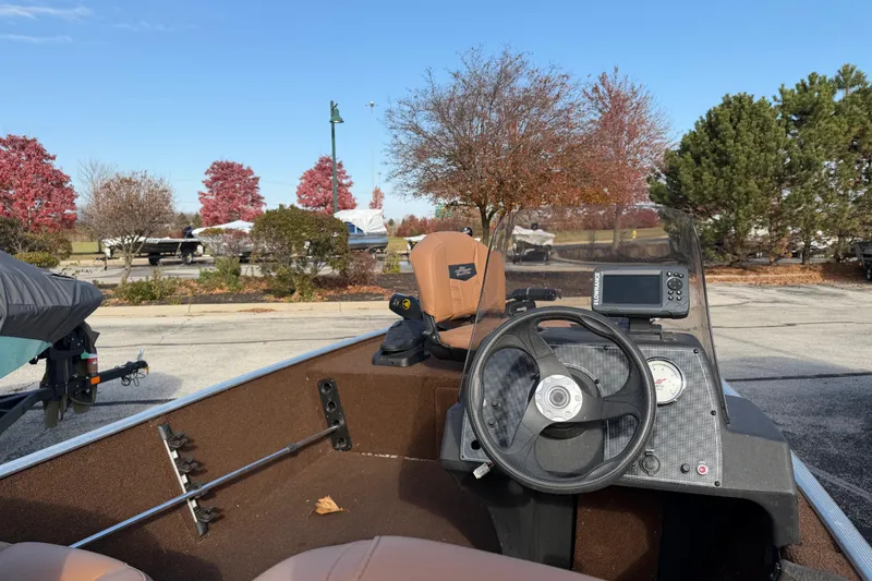 Slide: The Image of 2018 Tracker Bass Tracker 40th Anniversary Heritage Edition boat interior with steering wheel and console. - 6