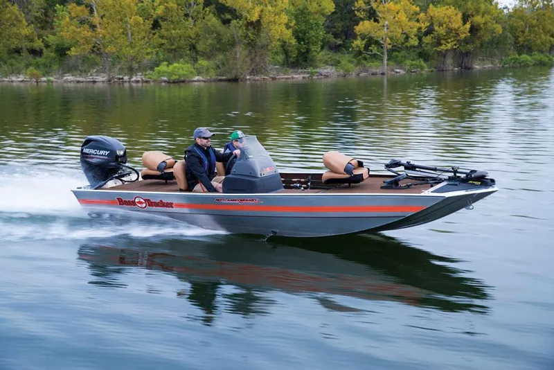 Slide: The Image of 2018 Tracker Bass Tracker 40th Anniversary Heritage Edition boat cruising on a lake. - 7