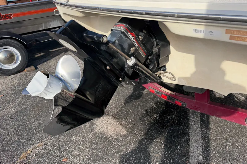 Slide: The Image of 1995 Sea Ray 200 Bow Rider boat with MerCruiser outdrive and propeller. - 3