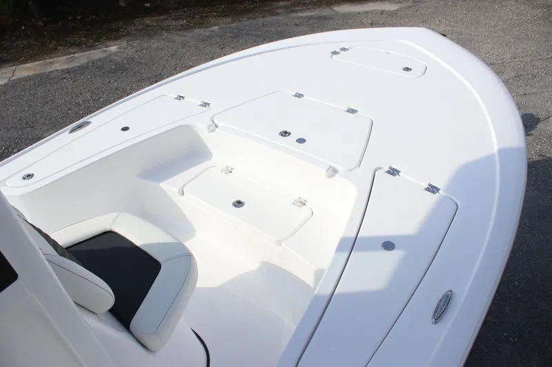 Slide: The Image of 2026 Tidewater 2110 Bay Max boat deck with storage compartments and seating. - 12