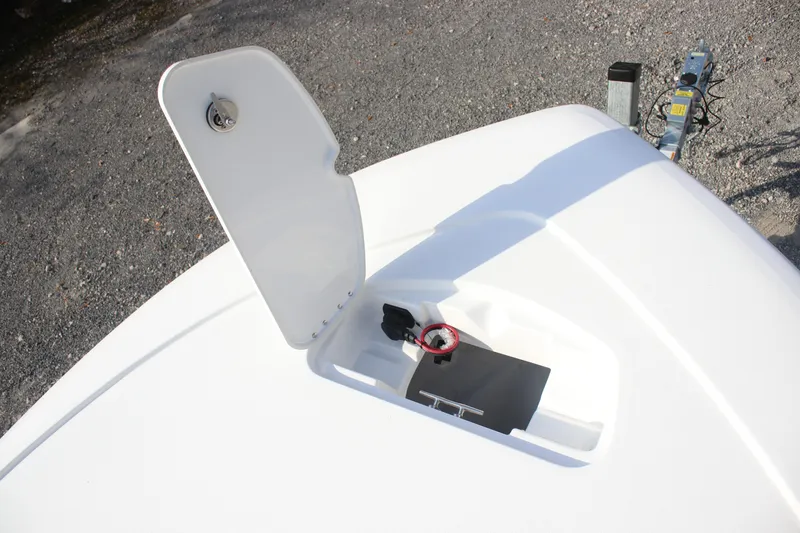 Slide: The Image of 2026 Tidewater 2110 Bay Max boat hatch open, showcasing storage compartment. - 13