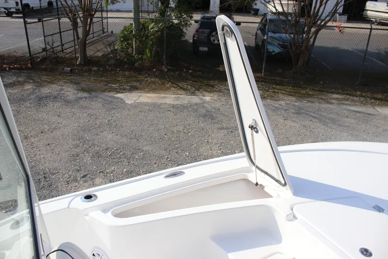 Slide: The Image of 2026 Tidewater 2110 Bay Max boat with open storage compartment. - 15