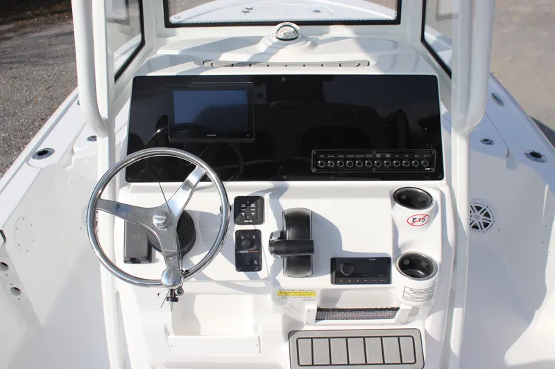 Slide: The Image of 2026 Tidewater 2110 Bay Max boat console with steering wheel and controls. - 19