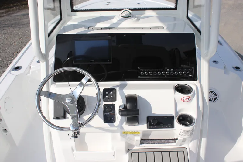 Slide: The Image of 2026 Tidewater 2110 Bay Max boat console with steering wheel and controls. - 20