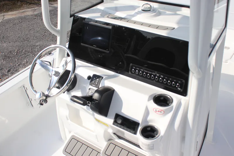 Slide: The Image of 2026 Tidewater 2110 Bay Max boat console with steering wheel and controls. - 21