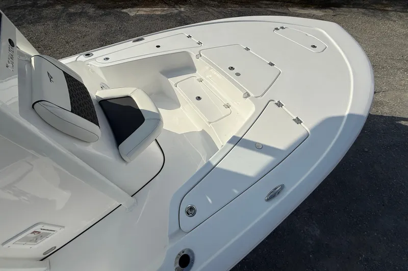 Slide: The Image of 2026 Tidewater 2110 Bay Max boat deck with seating and storage compartments. - 30